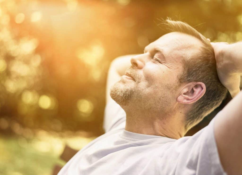 man sunbathing - preventative health assessment London - Echelon Health