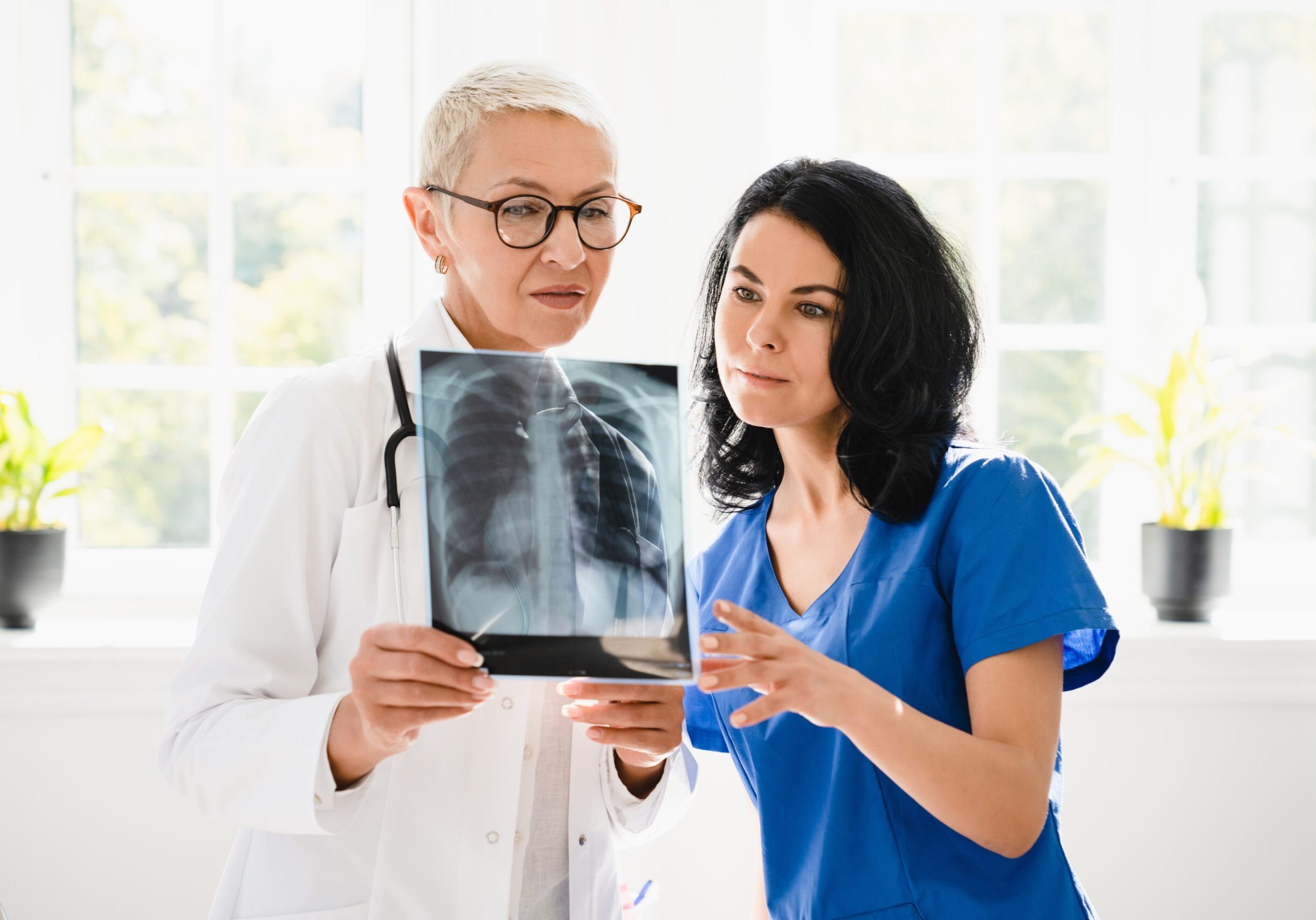 Two,Female,Doctors,Nurses,Interns,Caregivers,Checking,Discussing,Diagnosis,On